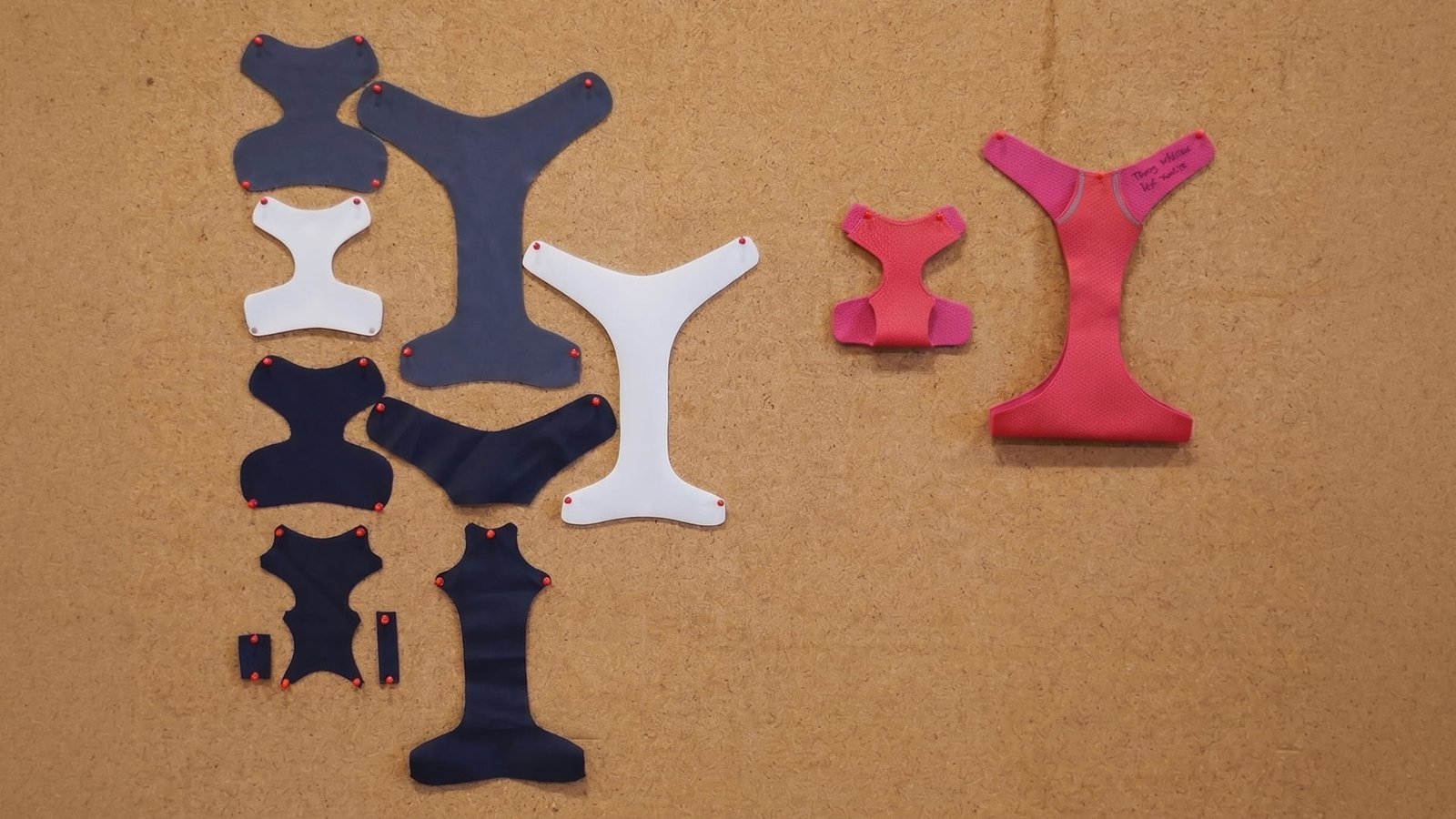 Some cookie cutter pieces of the Front Range Harness layed out on a work table